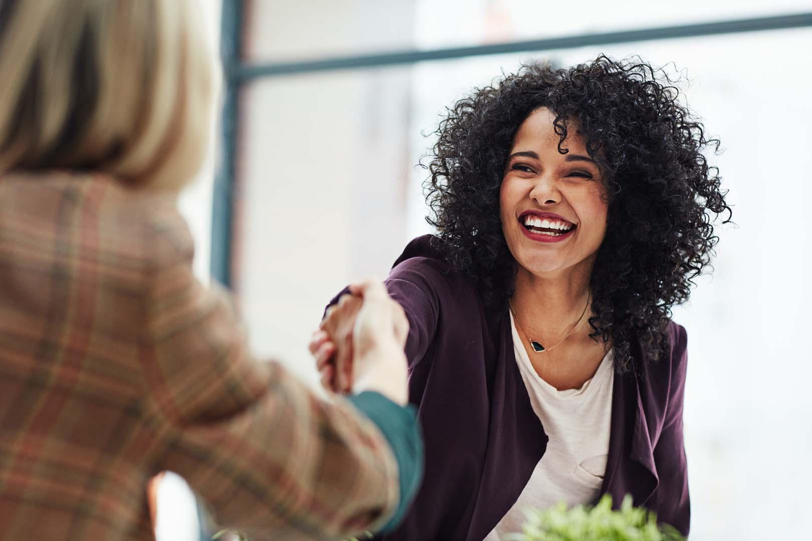 iStock-642501464 Photo of two business women shaking hands